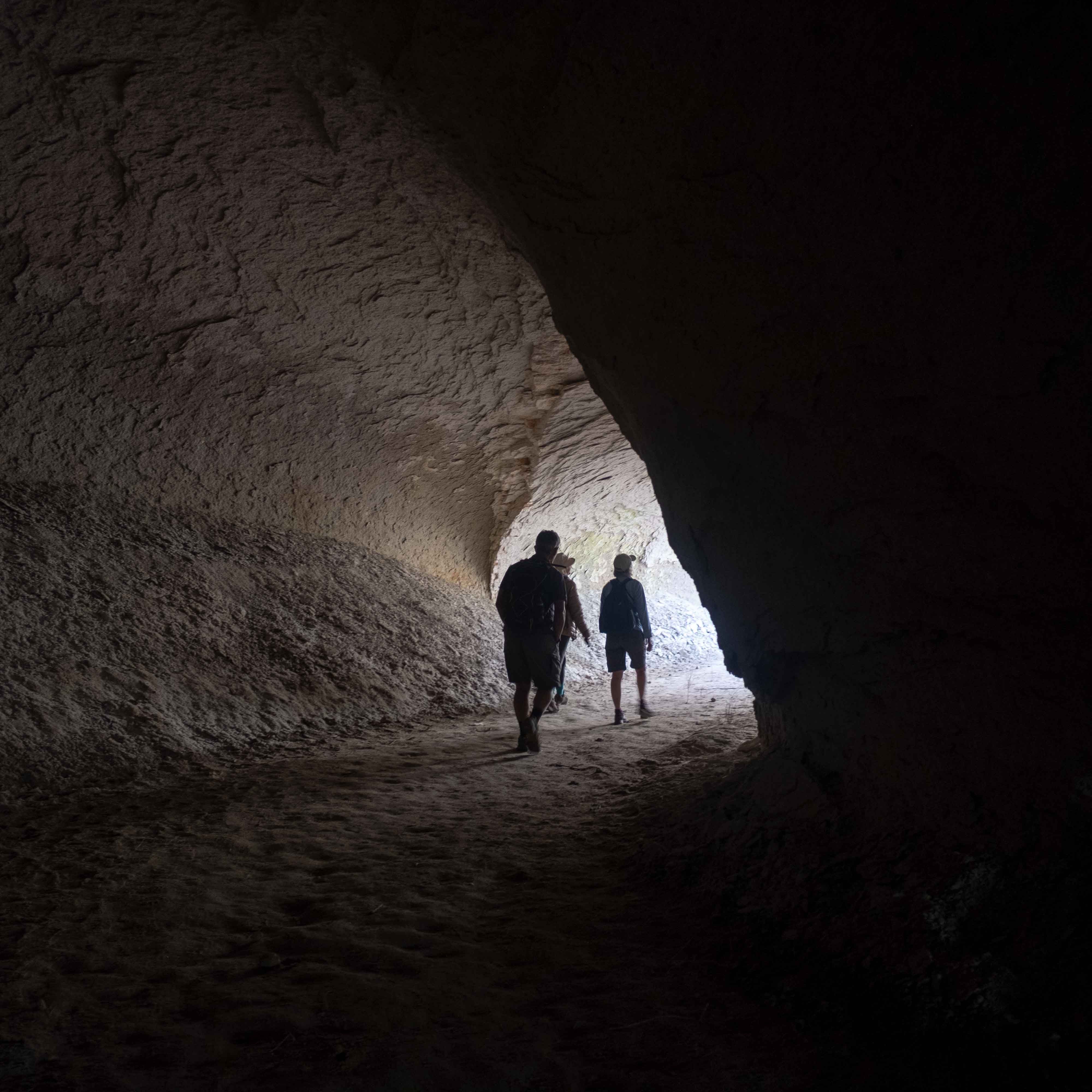 people walking through the tunnels of Balkan Deresi, Cappadocia 