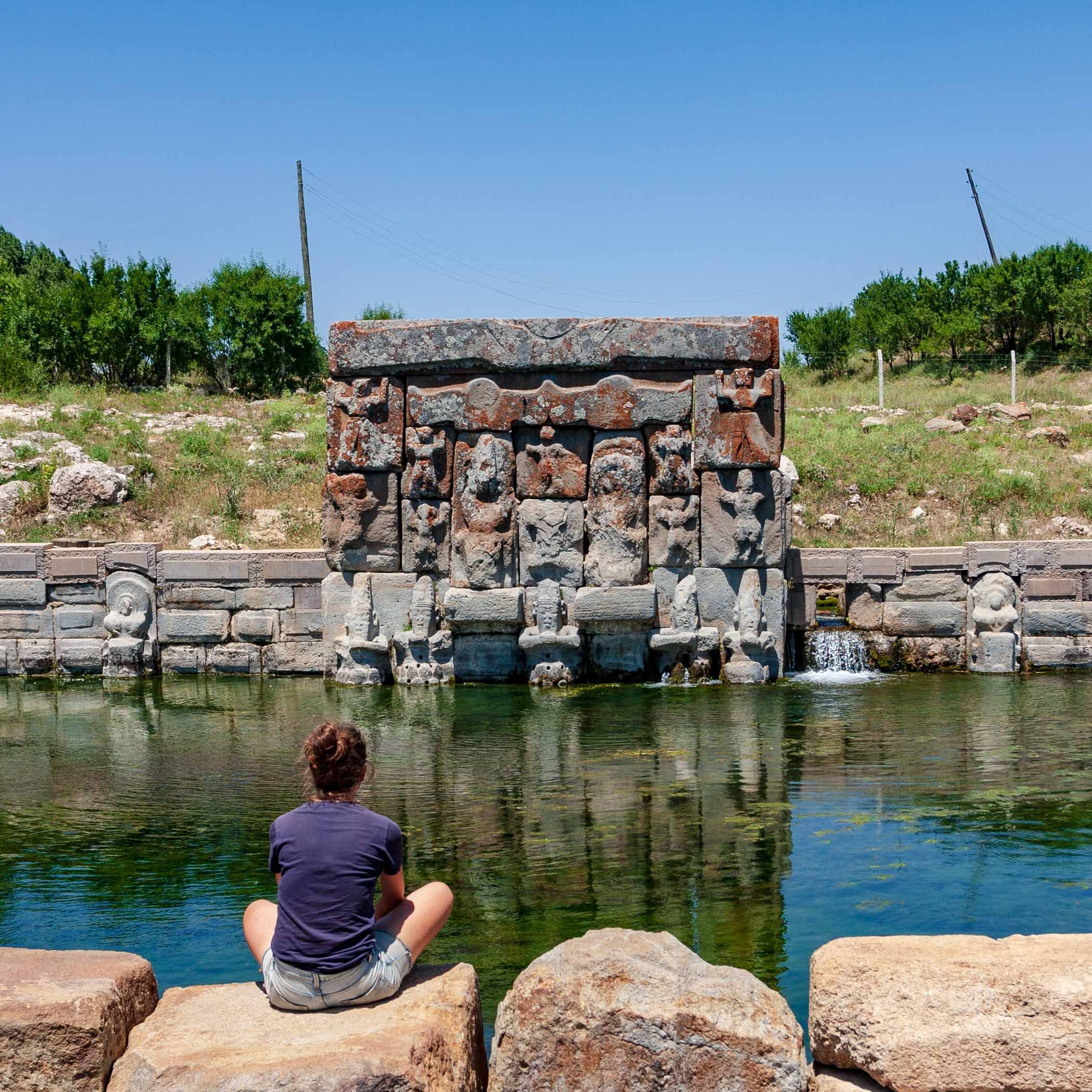 Sitting by the pool of a Hittite fountain, Eflatunpınarı
