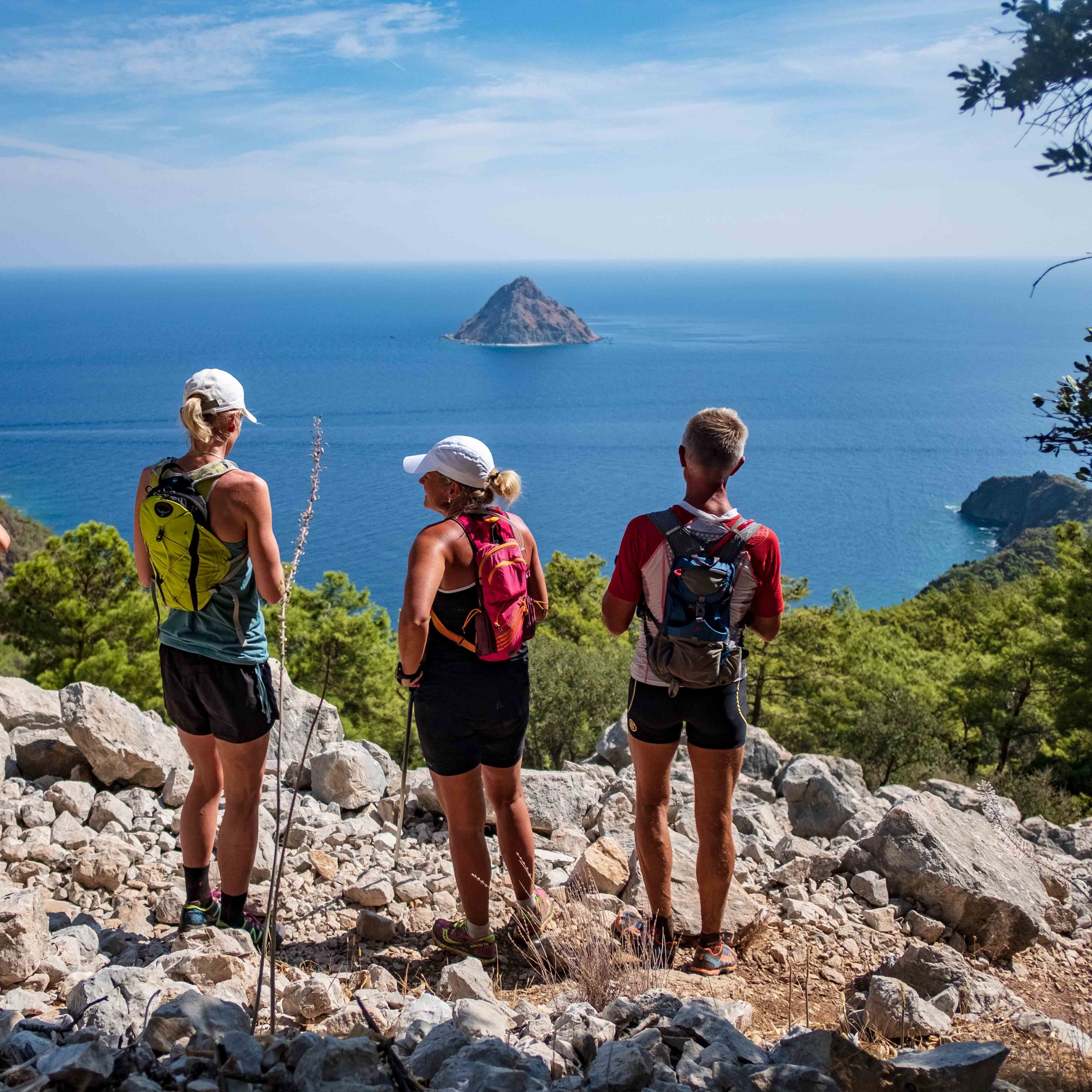 Hikers looking at Sulu Ada/island from the Lycian Way 
