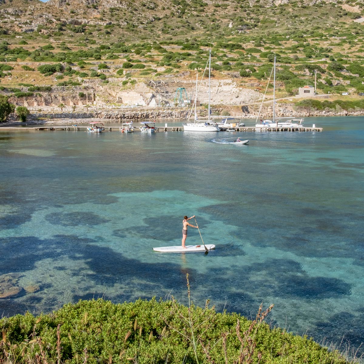 paddleboarder exploring the ruins of Knidos 