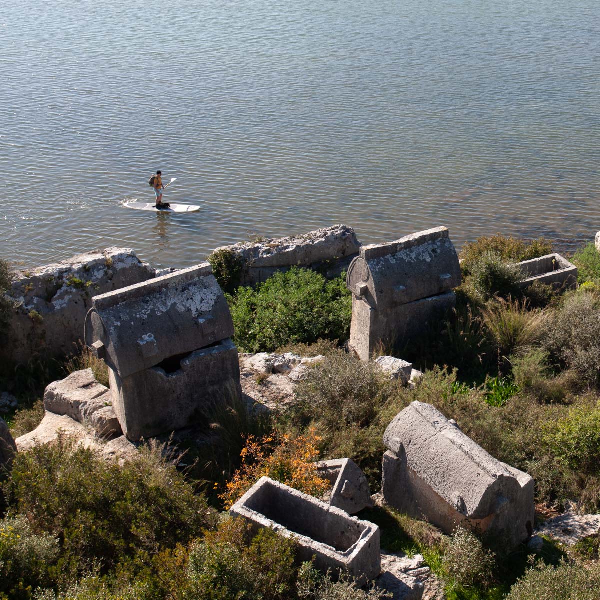 Paddleboarder by the ruins of Theimeussa