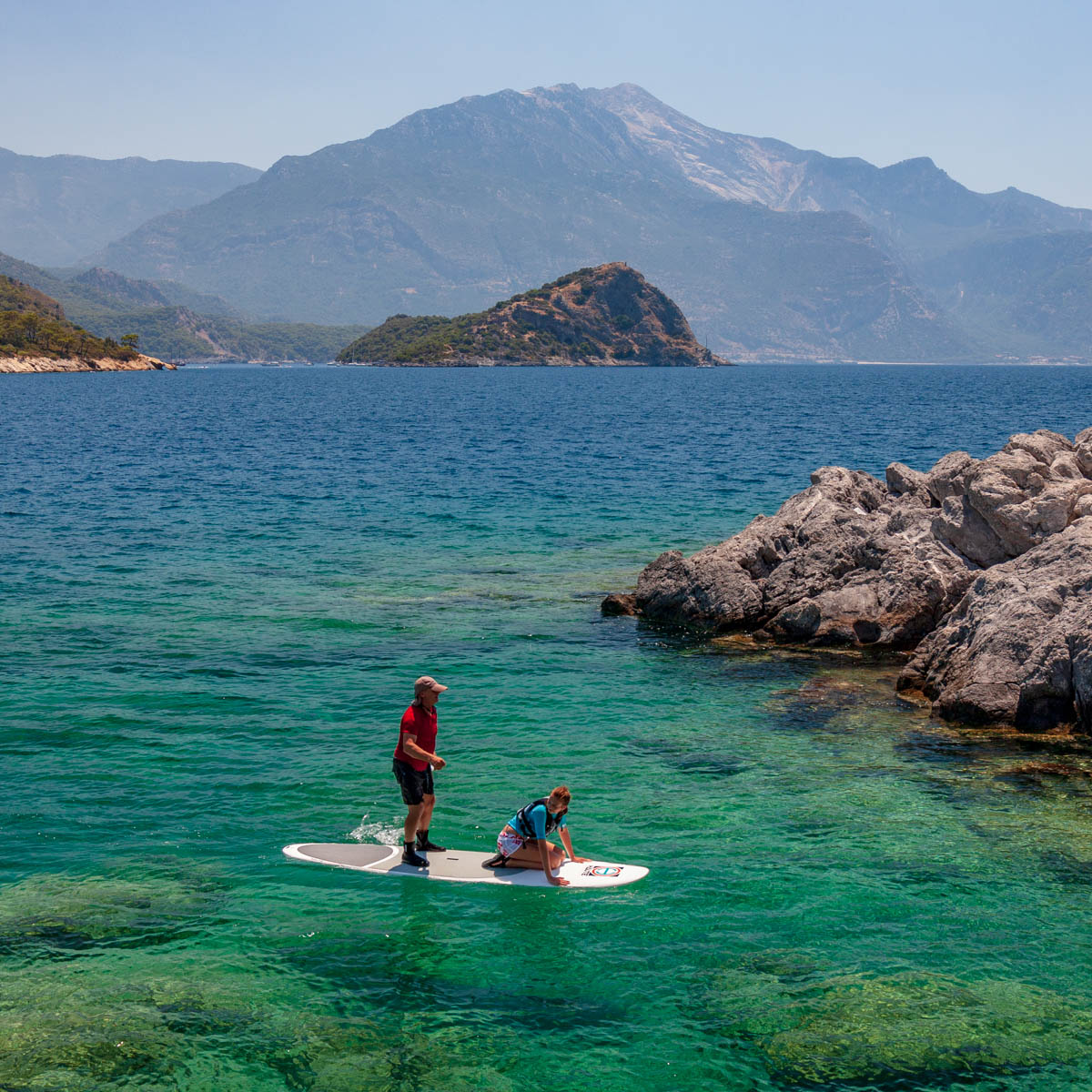 Tandem paddle boarders in Gemiler cove 